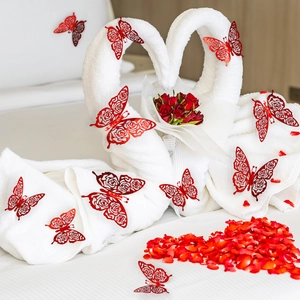 Detail of red hollow butterfly wall stickers used in a romantic swan and rose decoration