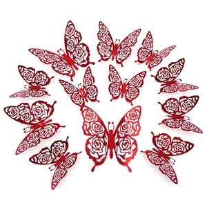 Detail of red glitter butterfly wall stickers with intricate rose cutout patterns