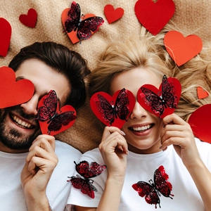 Detail of 3D laser-cut black and red butterflies and heart cards for Valentine decor