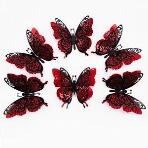 Detail of 3D layered butterflies with glitter red base and black rose cutout design