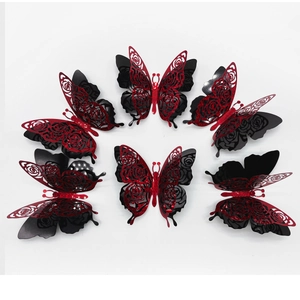 Detailed view of 3D layered butterfly wall stickers with red glitter laser-cut rose patterns