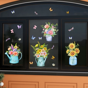 Close-up of watercolor floral stickers with butterflies on a modern window pane