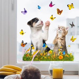 Detail of static window stickers showing cute dog, cat and butterflies in home setting