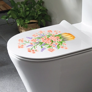 Floral toilet lid sticker with pink blooms and lavender on white ceramic surface