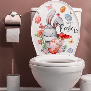 Close-up of Easter rabbit and colorful eggs sticker on a white toilet lid cover