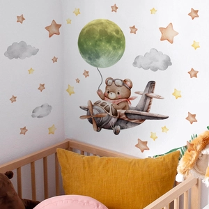 Nursery wall sticker with watercolor bear in airplane, green moon and yellow stars