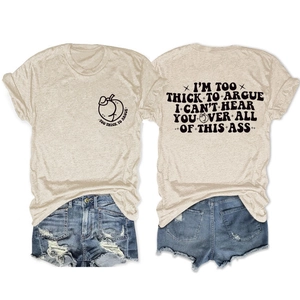 Detail of beige crew neck tee with peach logo and distressed denim shorts with raw edges