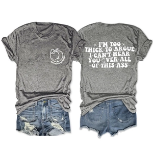 Flat lay detail of grey cotton T-shirt with peach print and ripped denim shorts