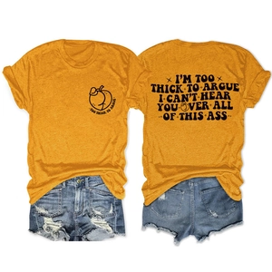 Flat lay of an orange cotton T-shirt with peach graphic and ripped denim shorts set