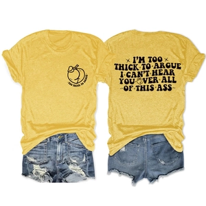 Flat lay of ginger yellow t-shirt with peach print and distressed denim shorts set