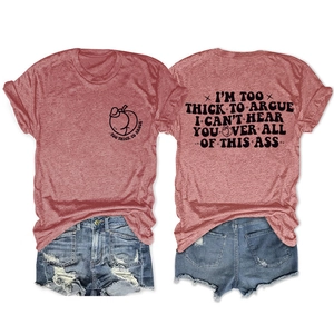 Flat lay of coral red T-shirt with 'Too Thick To Argue' slogan and ripped denim shorts