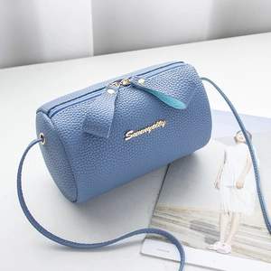Sky blue litchi pattern cylinder crossbody bag with golden logo and dual zippers