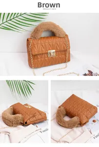 Detail view of quilted brown crossbody bag with plush handle and gold chain strap