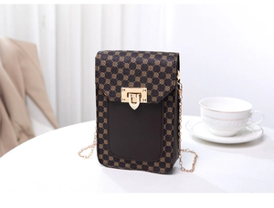 Close-up of vintage brown monogram phone bag with gold metal lock and chain strap