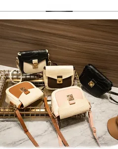 Detail of multi-color crossbody square bags with crocodile pattern and gold hardware