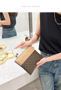 Detail of printed small clutch bag fitting a large smartphone with metal plate