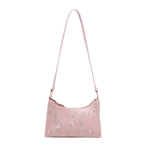 Pink leather shoulder bag for women featuring floral embroidery and gold metal rings