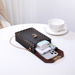 Brown vintage leather phone crossbody bag with floral pattern and gold chain strap