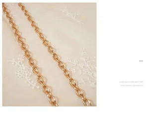 Close-up of a rose gold metal chain strap featuring scratch-resistant polished links