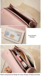 Detailed interior of the pink and white chain bag showing multi-compartment storage space