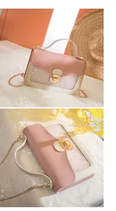 Detail of pink and white crossbody bag with star window and gold chain strap