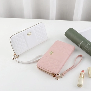 Quilted faux leather long wallets in white and pink with wristlet and gold hardware