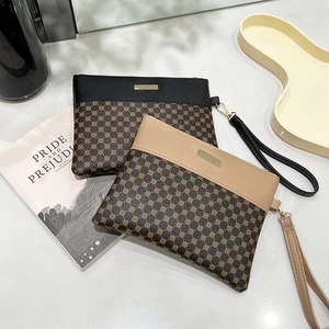 Classic patterned printed clutch handbag with wristlet strap in black and beige faux leather