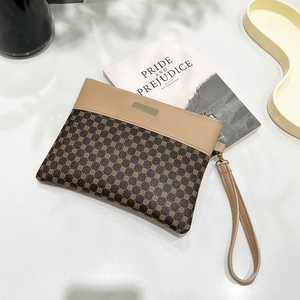 Fashionable printed leather clutch with vintage patterns and gold hardware detail