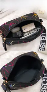Internal view of a printed crossbody bag showing large storage capacity and wide strap
