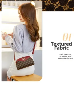 Detail of red and brown monogram crossbody shell bag with textured durable leather
