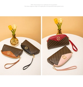 Detail view of four semi-circle wristlet bags in brown, black, red and pink monogram patterns