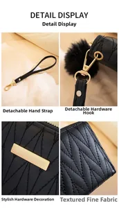 Detail of black quilted long wallet with golden hardware and soft pompom charm