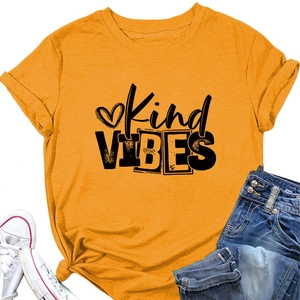 Detail of Kind VIBES slogan print on mustard yellow cotton t-shirt with knotted hem