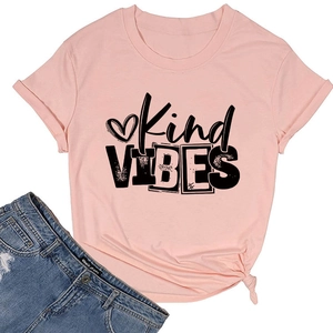 Flat lay of pink Kind VIBES T-shirt with knotted hem and distressed blue jeans