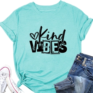 Detail of mint green Kind VIBES t-shirt with side knot and black artistic letter print