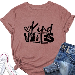 Detail view of Kind Vibes slogan and heart print on dusty rose cotton T-shirt