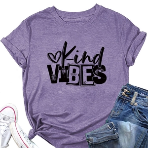 Detail of purple cotton T-shirt featuring Kind VIBES print and heart design on flat lay