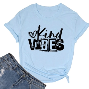 Close-up of light blue Kind Vibes T-shirt featuring a stylish side-knot hem detail