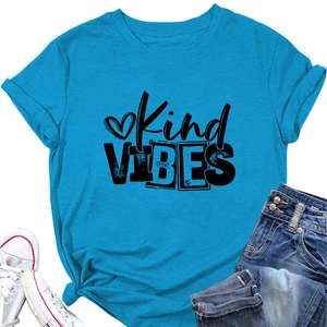 Detail of blue Kind Vibes cotton T-shirt featuring rolled sleeves and a stylish front hem knot