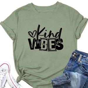 Flat lay of green Kind VIBES T-shirt with denim jeans and white canvas sneakers