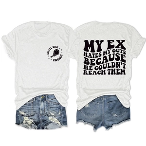 Flat lay of casual white slogan T-shirt and distressed denim shorts with frayed edges