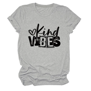 Close-up of Kind VIBES text and heart graphic on a light grey cotton t-shirt