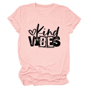 Detailed view of Kind Vibes printed text and heart motif on a light pink T-shirt