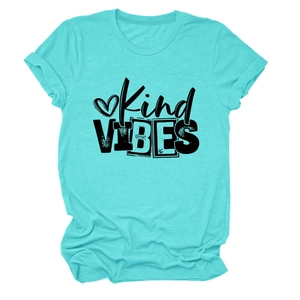 Close-up of Kind VIBES text and heart print on Tiffany blue short sleeve cotton T-shirt