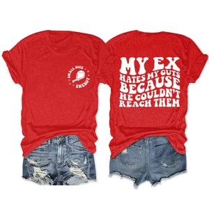Close-up of red T-shirt with Small Dick Energy print and ripped denim shorts