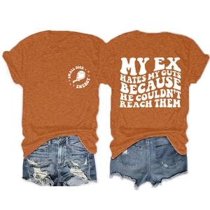 Front and back detail of orange t-shirt with slogan print and denim shorts outfit