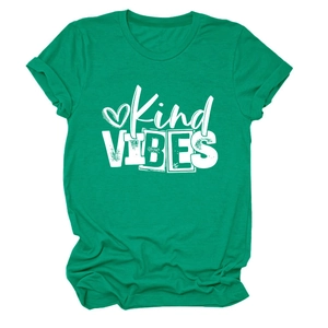 Macro detail of Kind VIBES print on emerald green cotton t-shirt with soft texture