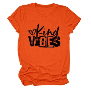 Detail of Kind VIBES print and heart graphic on orange crew neck t-shirt for women