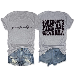 Detail view of grey cotton T-shirt featuring Somebody's Fine Ass Grandma text and denim shorts