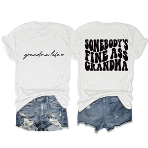 Flat lay of white cotton T-shirt with vintage black text and distressed denim shorts set